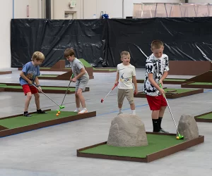 Children playing mini golf