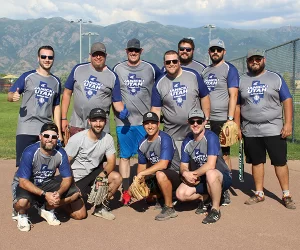 Employees from the softball team pose for a group photo