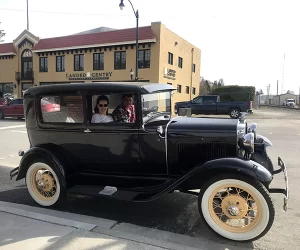 Tiffany and her husband Scott in an antique car