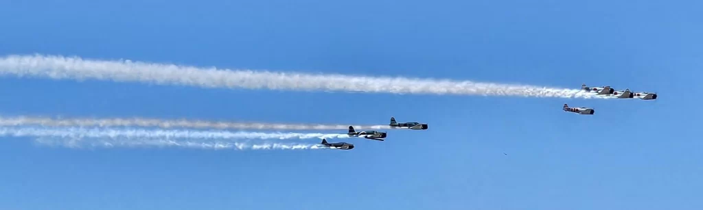 Six Commemorative Air Force planes fly over head