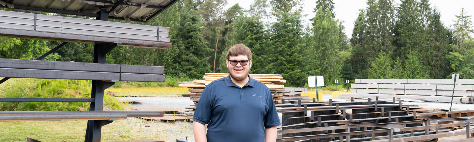 Charles standing in front of metal