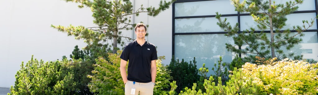 Noah standing in front of Building 5